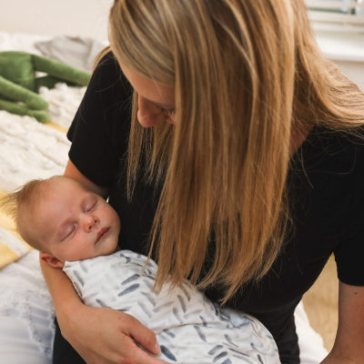 A mom holding her baby
